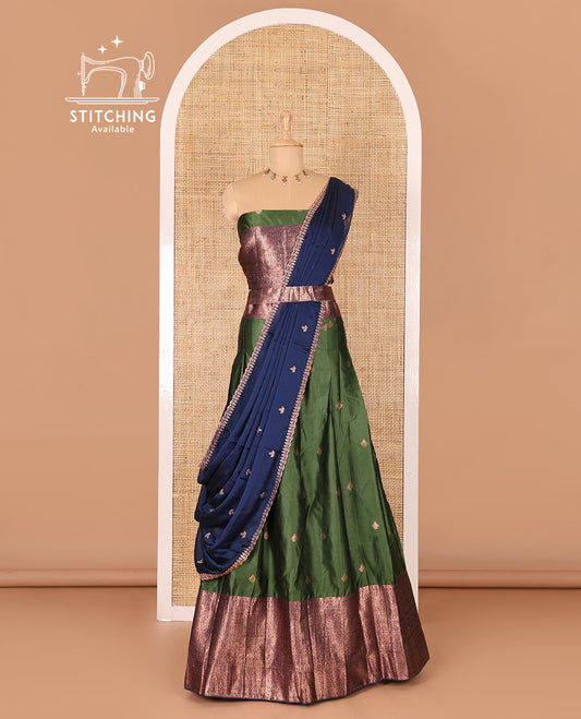 Bottle green taffeta silk half-saree, zari buttas and contrast traditional zari bordered skirt, a matching blouse, and contrast embroidered satin georgette  dhavani
