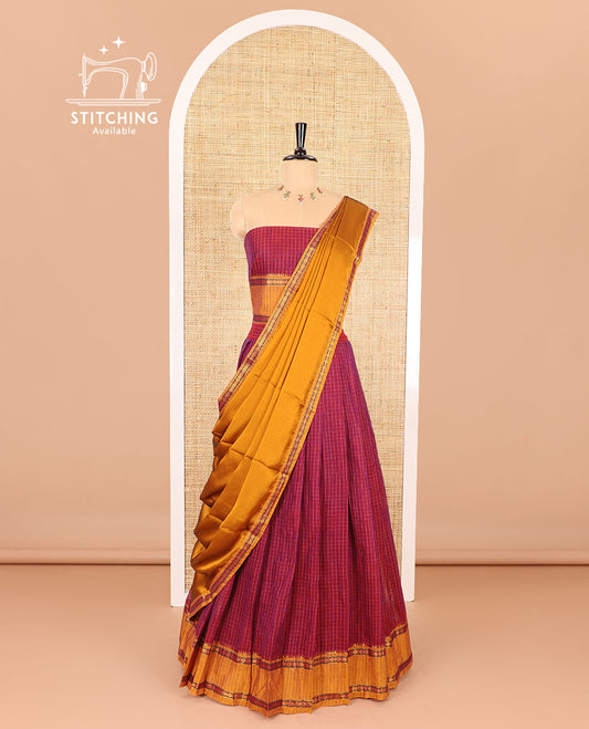 Maroon half-saree, checked with contrast traditional motifs zari bordered skirt, matching blouse and a contrast zari border plain dhavani