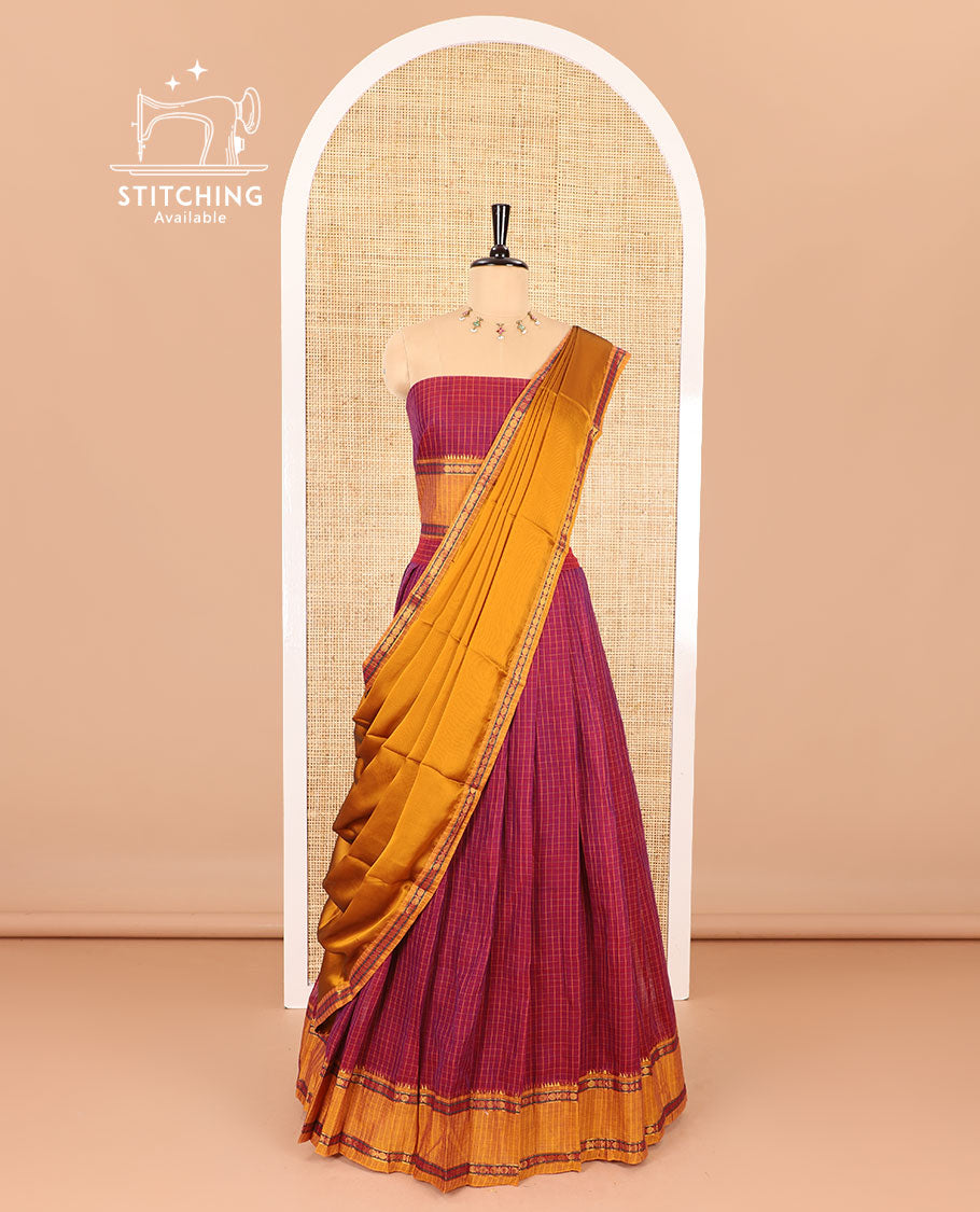 Maroon half-saree, checked with contrast traditional motifs zari bordered skirt, matching blouse and a contrast zari border plain dhavani