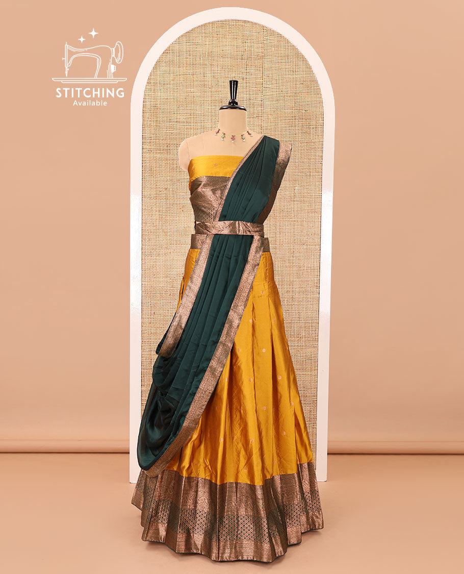Mustard-green taffeta half-saree, zari buttas with contrast traditional zari bordered skirt, a matching blouse, and contrast zari border dhavani with belt