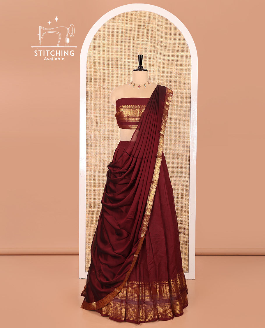 Maroon Chettinad Cotton Half-Saree Featuring Plain Skirt, Elevated with a Contrast Traditional Zari Design Varisai Pettu Border, Paired with a Matching Blouse, and a Satin Georgette Zari Bordered Dhavani