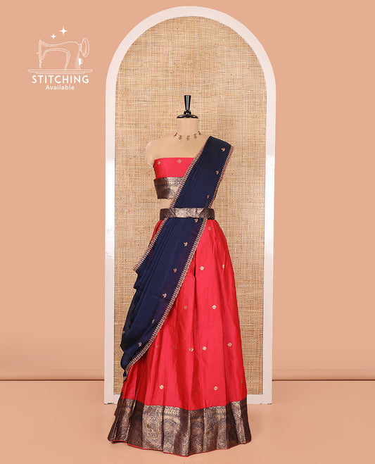 Pink and Blue Semi-Banarasi Half-Saree, Elegantly Woven with Zari Buttas on Its Skirt, Complemented by a Contrast Geometric Patterns Zari Woven Border, Paired with a Matching Blouse, and a Contrast Satin Georgette Embroidered Scallop Dhavani