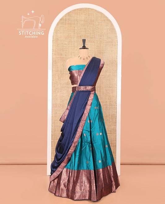 Blue and Navy Blue Semi-Banarasi Half-Saree, Adorned with Zari Buttas on Its Skirt, Complemented by a Contrast Traditional Zari-Design Border, Paired with a Matching Blouse, and a Contrast Satin Georgette Zari-Bordered Dhavani