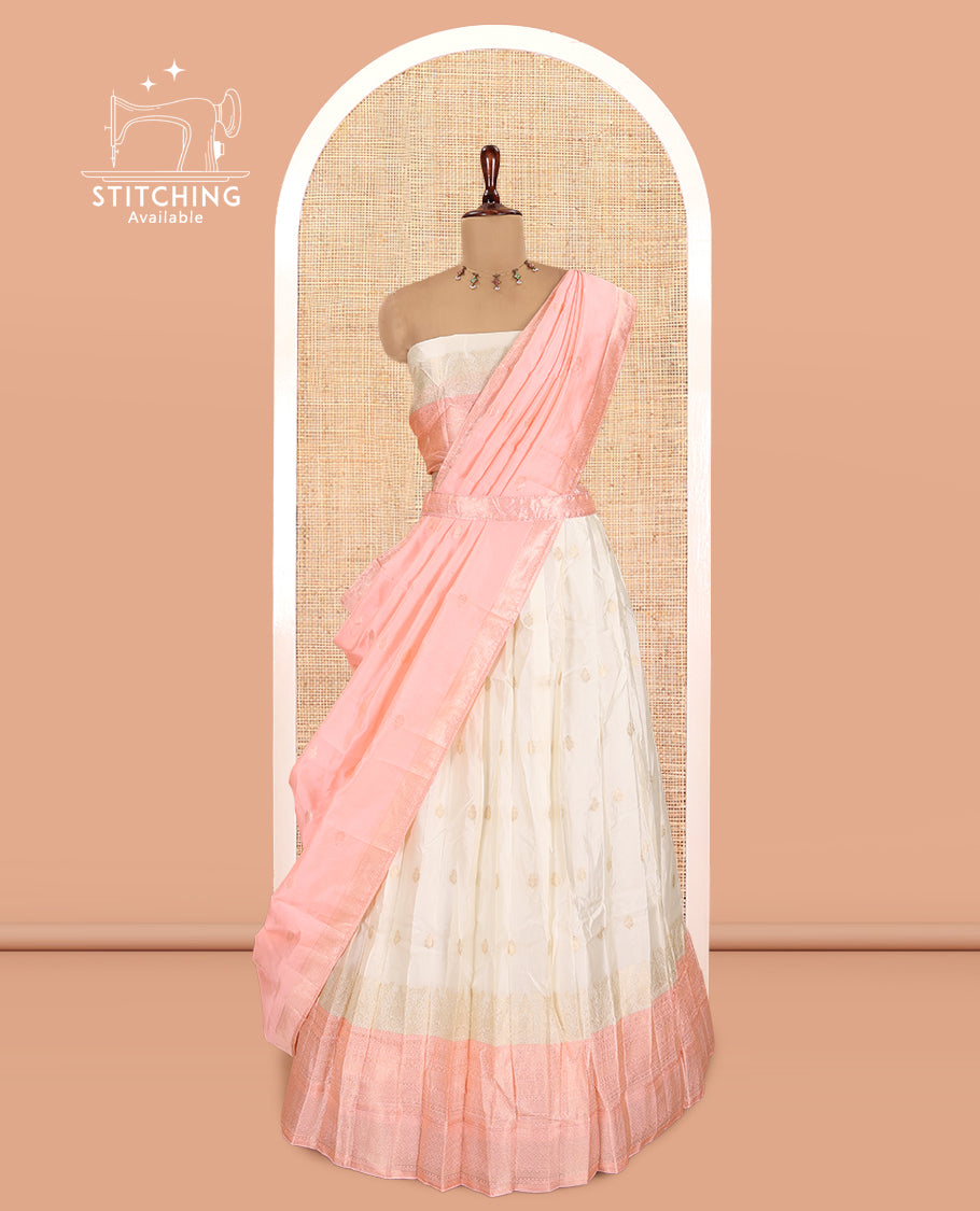 Cream-Peach Semi-Silk Half-Saree, Subtly Sparkled with Zari Buttas Skirt, a Contrast Traditional Zari Border, and a Contrast Dhavani
