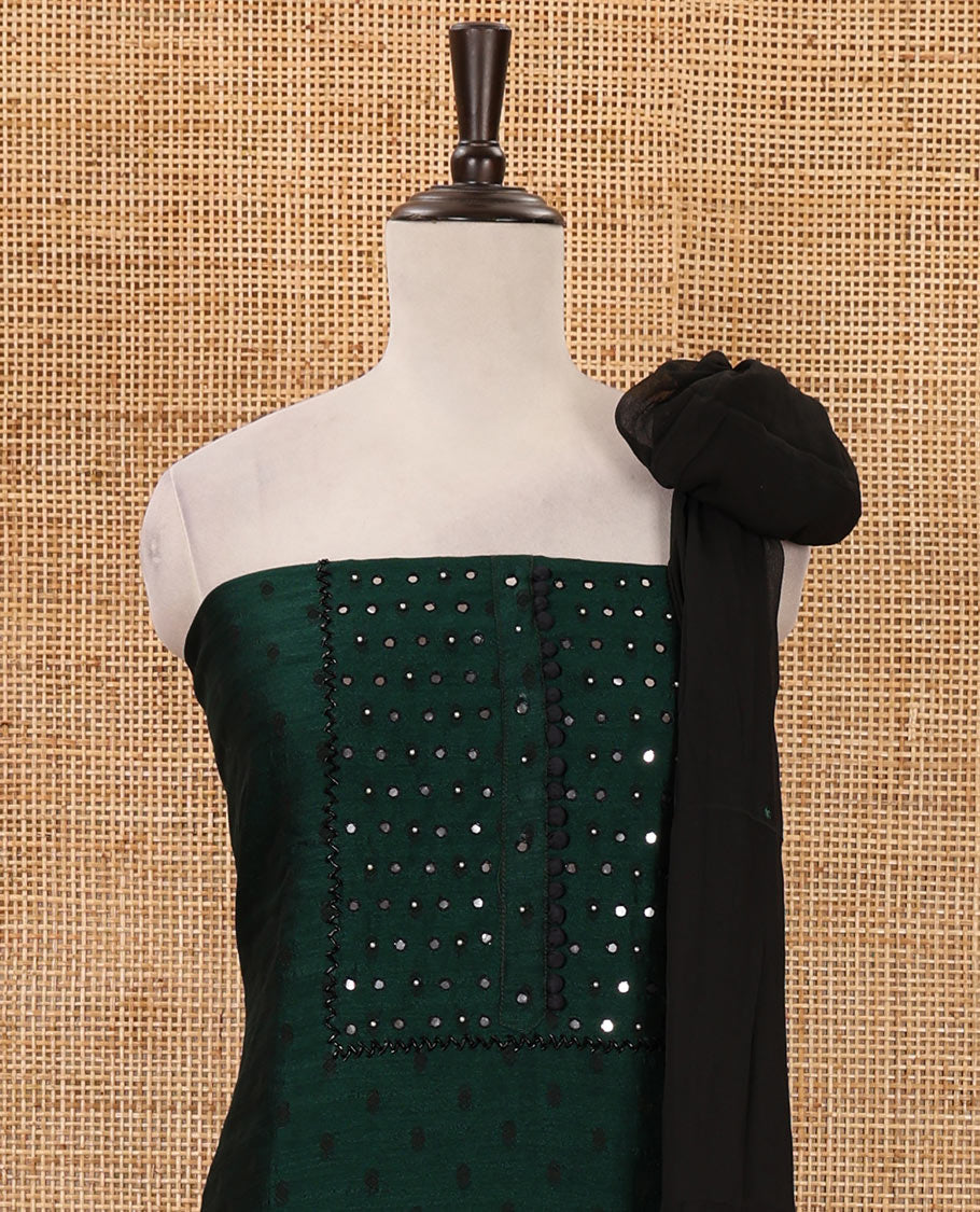 Green material chudidar set, black beads & mirror neck embroidered with buttas woven vichitra silk top, santoon bottom & contrast mirror work chiffon dupatta