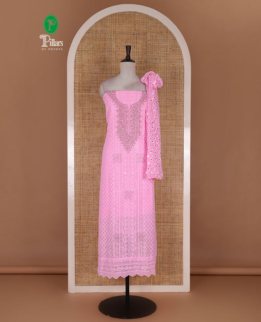 Pink material churidar set, stone work with Schiffli style embroidered georgette top, American Crape bottom, and polka dotted printed mirror work dupatta