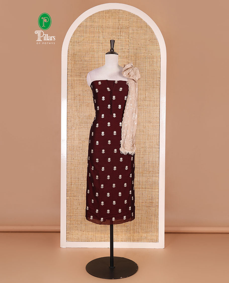 Dark brown Vichitra silk material churidar set, floral motifs embroidered top, contrast Santoon bottom, and floral vine thread embroidered scallop dupatta