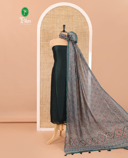 Bottle green material chudidar set, plain Vichitra silk top, santoon bottom, and dupatta of Ajrakh print and mirror work