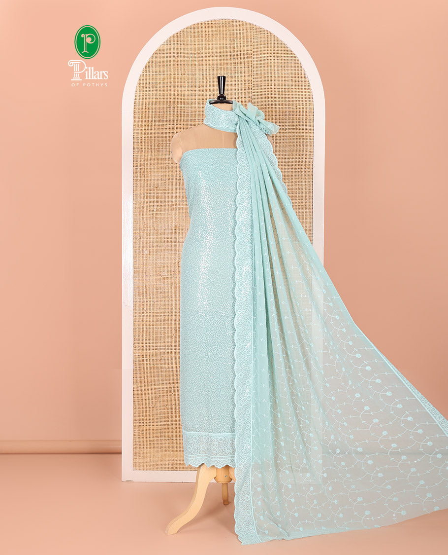 Blue Material Chudidar Set Features Sequin Embroidered Georgette Top, a Plain American Crepe Bottom, and a Scallop Dupatta Embellished with Floral Vine Embroidery