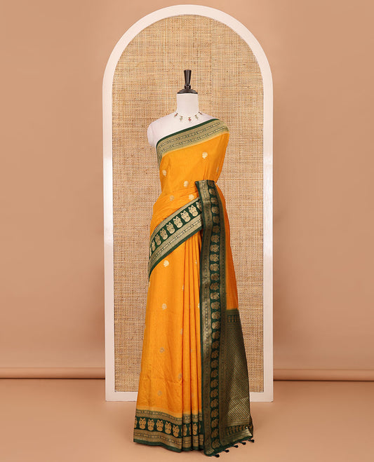 Mustard peacock buttas dola silk saree, contrast rudraksham & iruthalai pakshi border, intricate pallu & contrast jacquard blouse