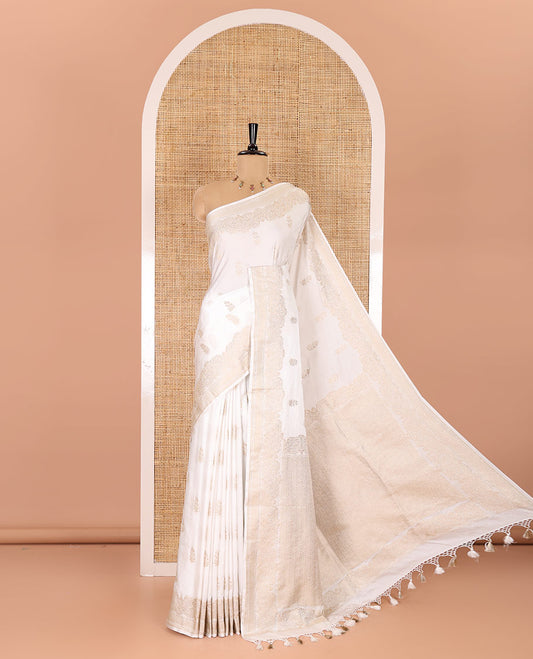 White floral buttas mushru silk saree, traditional zari border, jaal pallu, and a matching blouse