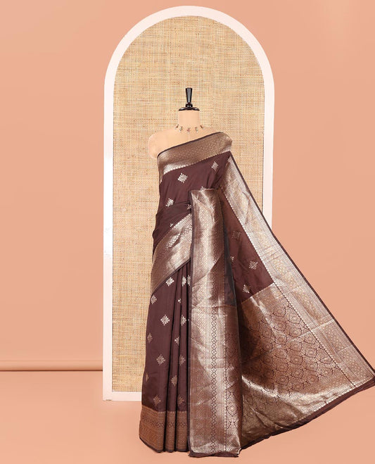 Coffee Brown Litchi Silk Saree, Mesmerized with Kolam Buttas All Over Its Body, Highlighted by a Traditional Zari Designs Woven Border, Grand Pallu of Intricate Designs, and Paired with a Matching Blouse