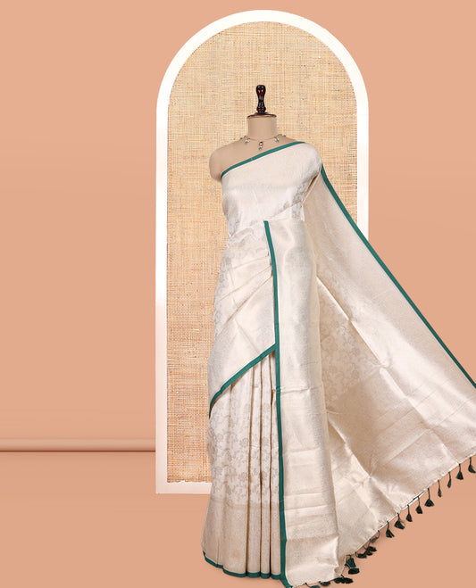 Off-White-Leaf Green Semi-Silk Saree, Adorned with Floral Jacquard Design, a Zari Paisley Border, and a Contrast Blouse