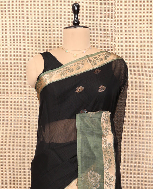 Black Silk Cotton Saree, Adorned with Zari Buttas, Complemented by a Contrast Floral-Peacock Zari Border, Grand Jaal Pallu, and a Contrast Blouse