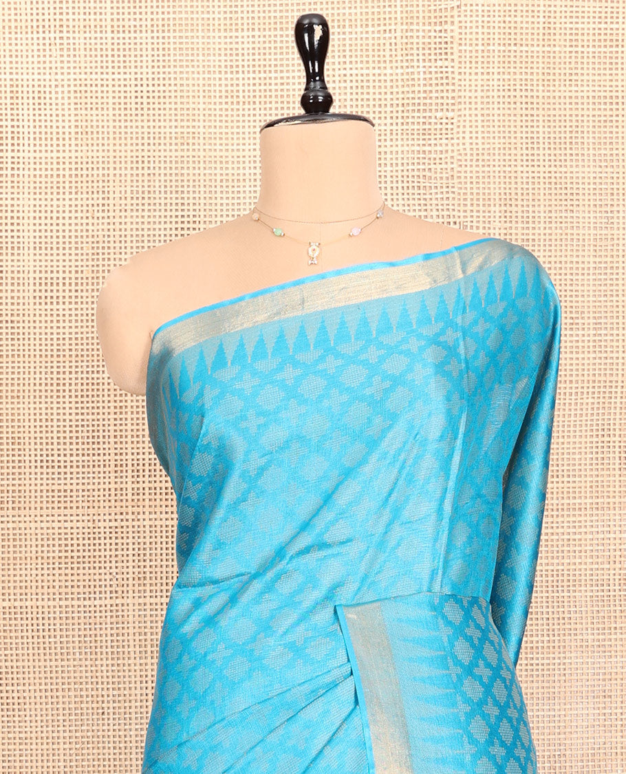 Blue Tussar Silk Saree, Subtly Sparkled with Buttas, a Subtle Temple Border, Pallu Features Stripes and Buttas, and a Matching Blouse
