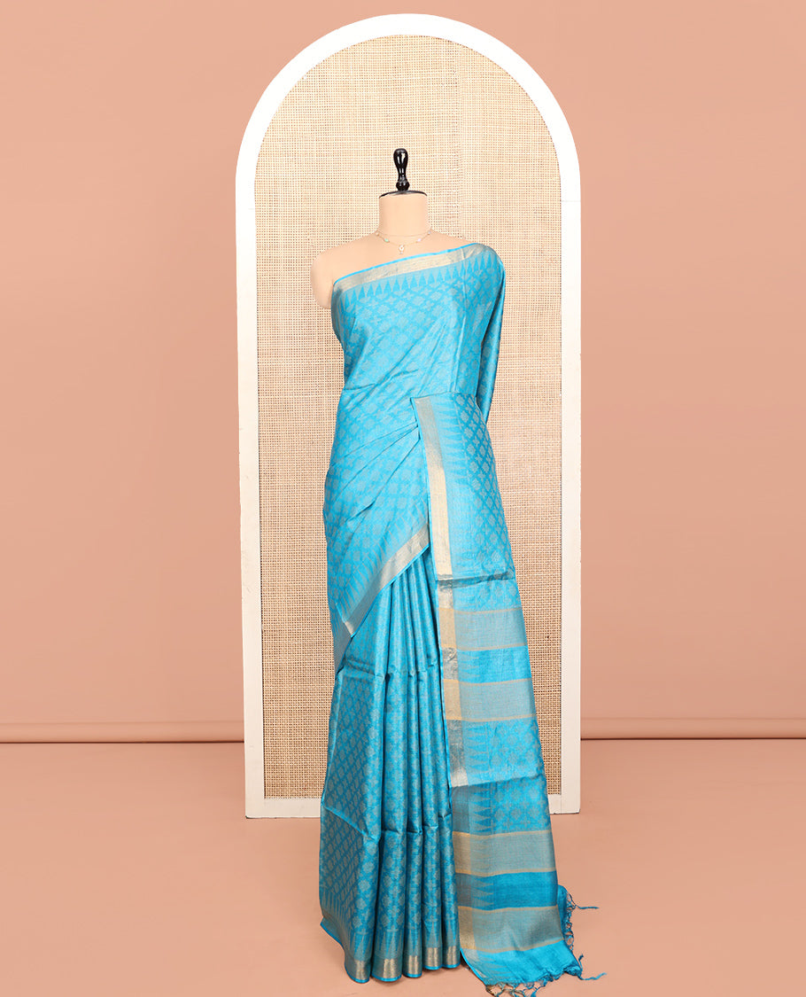 Blue Tussar Silk Saree, Subtly Sparkled with Buttas, a Subtle Temple Border, Pallu Features Stripes and Buttas, and a Matching Blouse