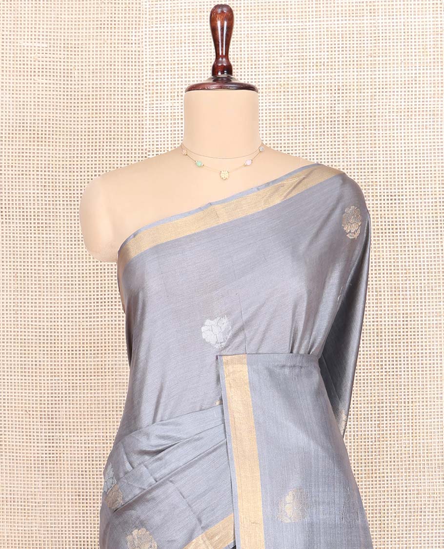 Grey Tussar Silk Saree, Sparsely Woven with Zari Buttas on Its Body, Subtly Woven Bavanji Border, Intricately Zari-Designed Pallu, and Paired with a Matching Blouse