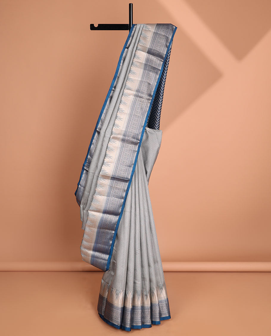 Light grey checked tussar saree with contrast traditional zari design border & chevron design pallu