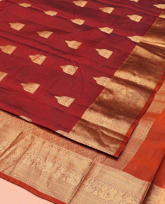 Maroon Vasundhara Lite-Silk Mix Saree, Detailed with Zari Buttas All Over Its Body, Highlighted by a Zari Border of Rekku, Kamalam, Kuyil Kann, Yaanai, and Mayil Designs, Grand Pallu of Jaal Designs, and Paired with a Contrast Blouse