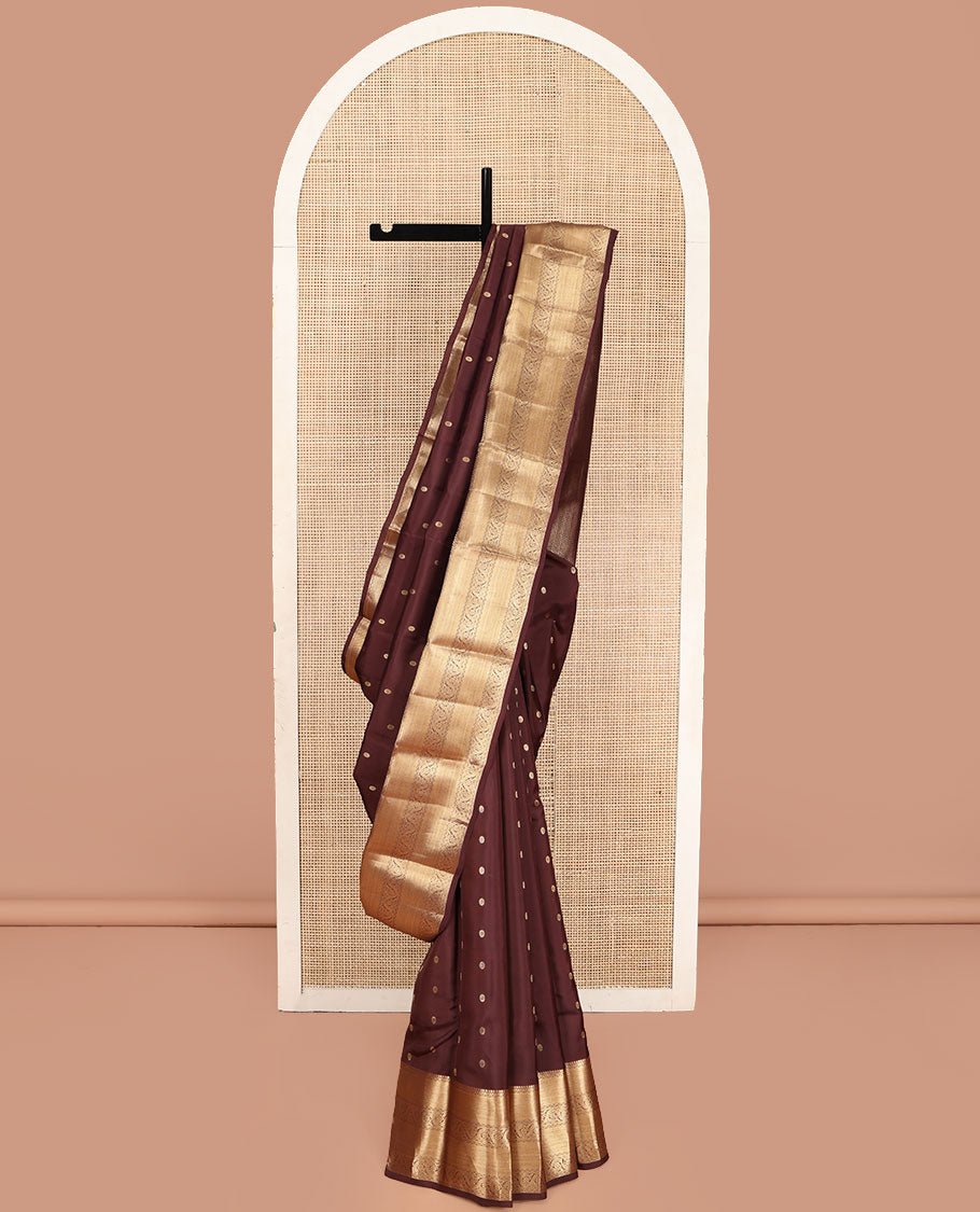 Brown Vasundhara Lite Silk Mix Saree, Decked Up with Zari Buttas All Over Its Body, Highlighted by a Zari Border of Salngai, Muthu, Dhavana Kodi, and Mayil Kann Designs, Pallu of Leaf Vine Designs, and Paired with a Matching Blouse