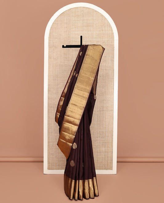 Brown Vasundhara Silk Mix Saree, Decked Up with Zari Buttas All Over Its Body, Highlighted by Zari Border of Thilakam Mokku, Laddu Kamalam, and Zari Designs, Grand Jaal Pallu and Paired with a Matching Blouse