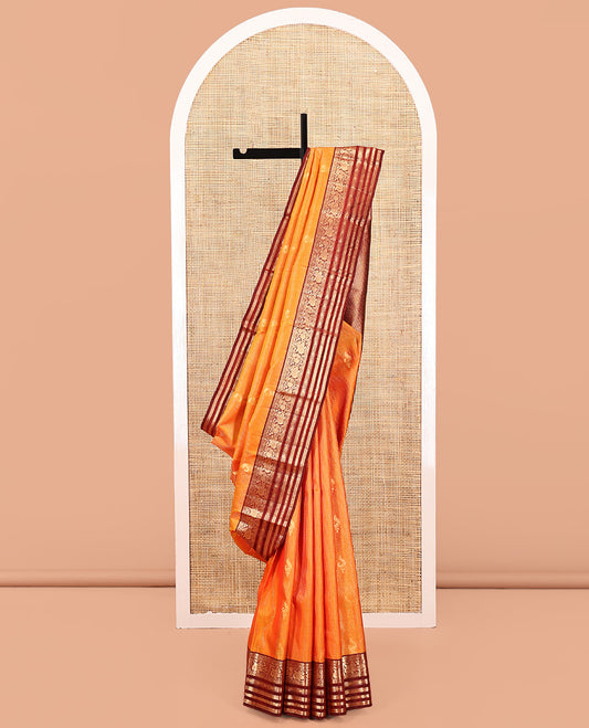 Orange Vasundhara Silk Saree, Masterfully Woven with Zari Buttas and Checks All Over Its Body, Complemented by a Contrast Border of Thilakam Mokku, Manga, Mayil, and Meen Designs, Grand Pallu, and Paired with a Contrast Blouse