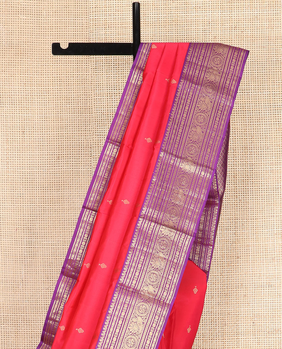 Red Vasundhara Silk Saree Adorned with Zari Buttas, Complemented by a Contrast Border of Thilakam  Mokku, Banaras, Rudraksham, Kathir, Cross Neli, and Anna Chakram Designs, Pallu Decked Up with Jaal Designs, and Paired with a Contrast Blouse