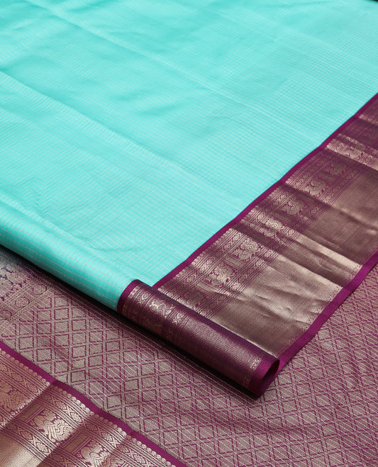 Blue micro-checked silk saree, contrast border of salngai, banaras, laddu kamalam, and annam motifs, and jaal design pallu