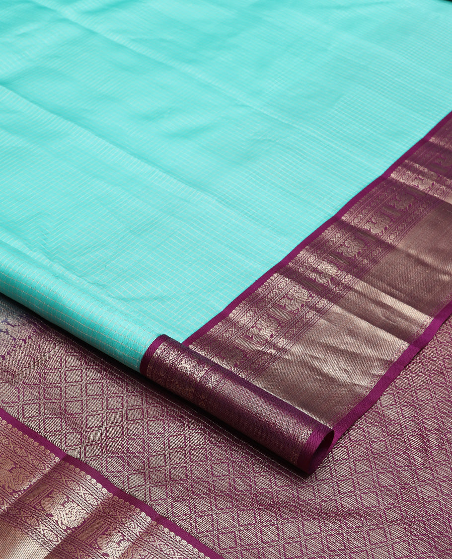 Blue micro-checked silk saree, contrast border of salngai, banaras, laddu kamalam, and annam motifs, and jaal design pallu