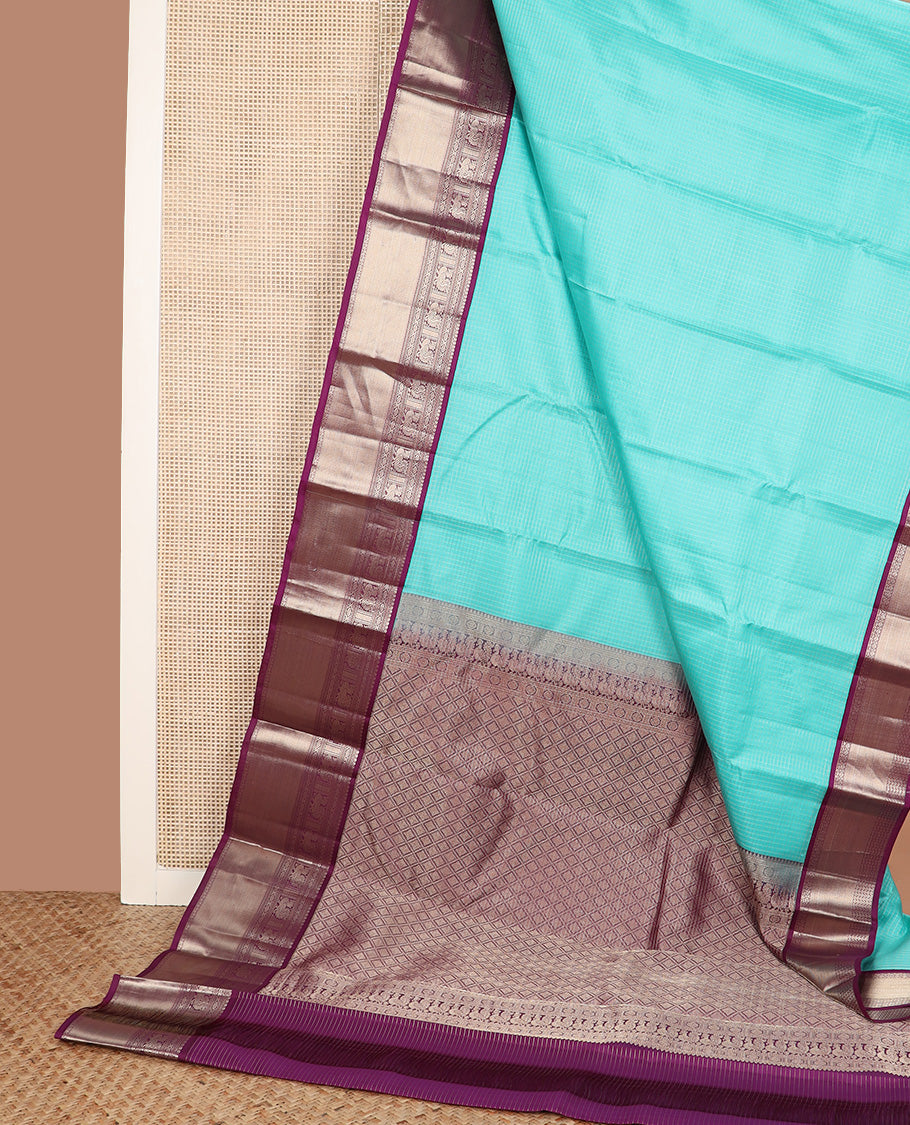 Blue micro-checked silk saree, contrast border of salngai, banaras, laddu kamalam, and annam motifs, and jaal design pallu
