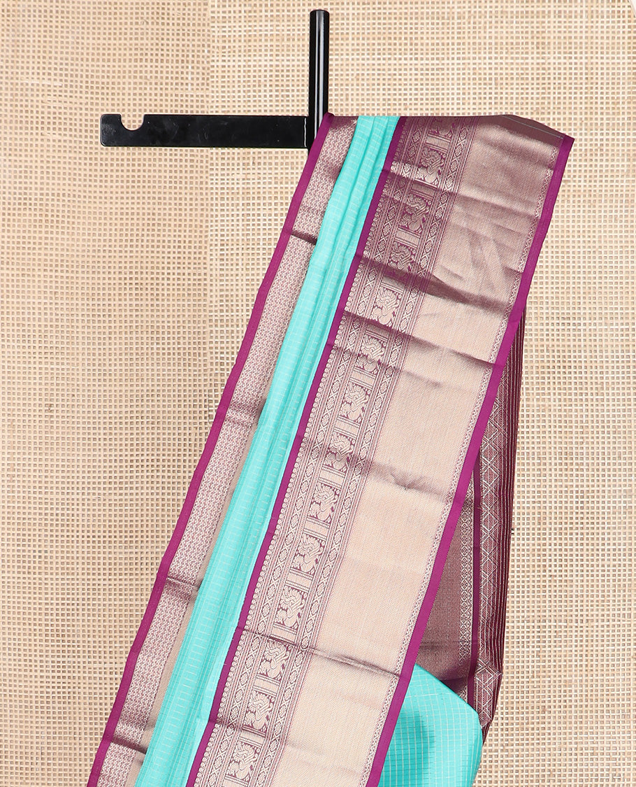 Blue micro-checked silk saree, contrast border of salngai, banaras, laddu kamalam, and annam motifs, and jaal design pallu