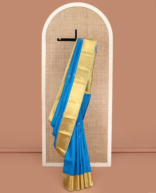 Blue Vasundhara Silk Saree, Decked Up with Zari Buttas  All Over Its Body, Complemented by Contrast Border of Traditional Designs, Pallu of Floral Designs, and Paired with a Contrast Blouse