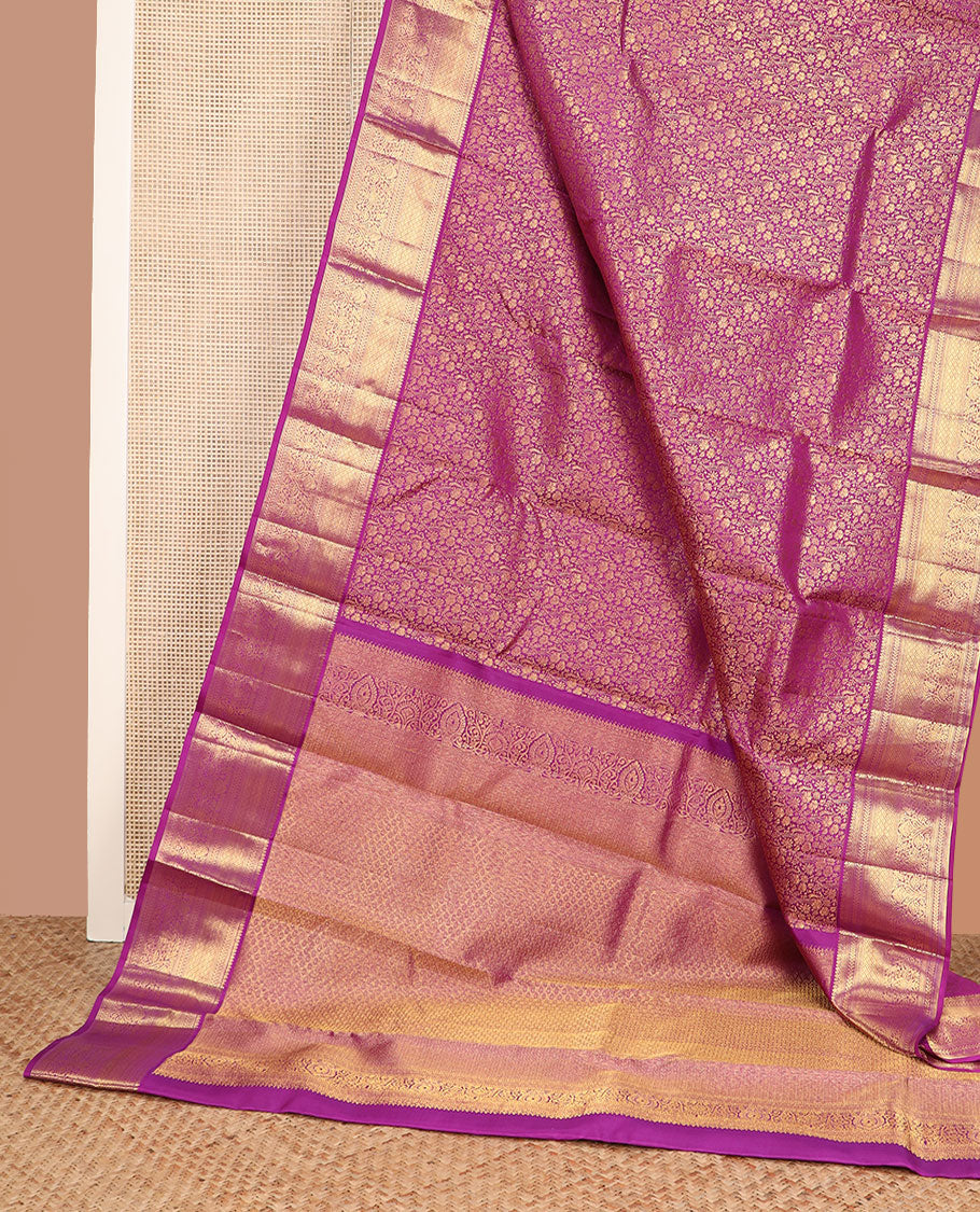 Purple floral jacquard Kanchipuram wedding silk saree, traditional zari border, and pallu of jaal design