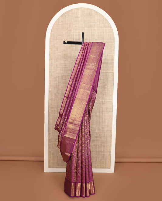 Purple floral jacquard Kanchipuram wedding silk saree, traditional zari border, and pallu of jaal design