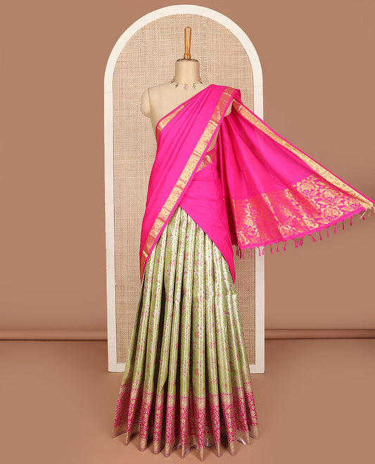 Green art silk half saree, floral meena jacquard with contrast traditional zari border skirt, jacquard contrast blouse and floral weave dhavani