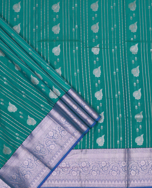 Green art silk pavadai set,  zari design and contrast traditional zari bordered skirt and a contrast zari border blouse