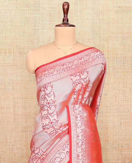 Red Semi-Banaras Silk Saree, Richly Detailed with Animal-themed Jacquard Designs on Its Body, Highlighted by a Zari Border of Traditional Designs, Pallu Steeped with Stripes, and Paired with a Matching Blouse