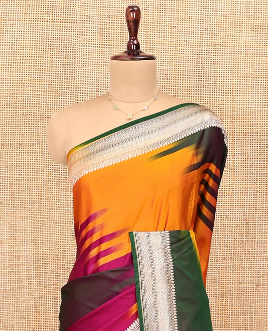 Multi-Color Banarasi Silk Saree, Gracefully Embellished with Colorful Ikkat Weave on Its Body, Highlighted by a Self-Border of Traditional Designs, Pallu of Big Paisley Designs, and Paired with a Matching Jacquard Blouse