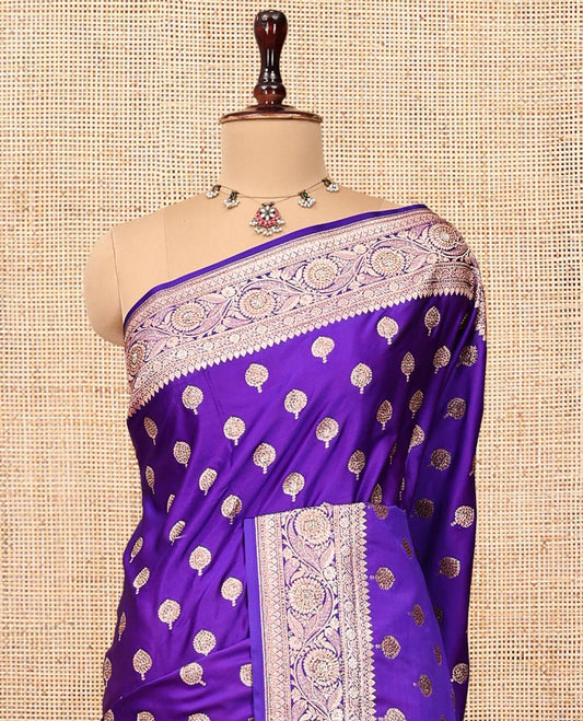 Violet Banarasi Satin Saree, Elevated with Zari Buttas, a Floral Creeper Border, Intricate Stonework Pallu, and a Matching Blouse