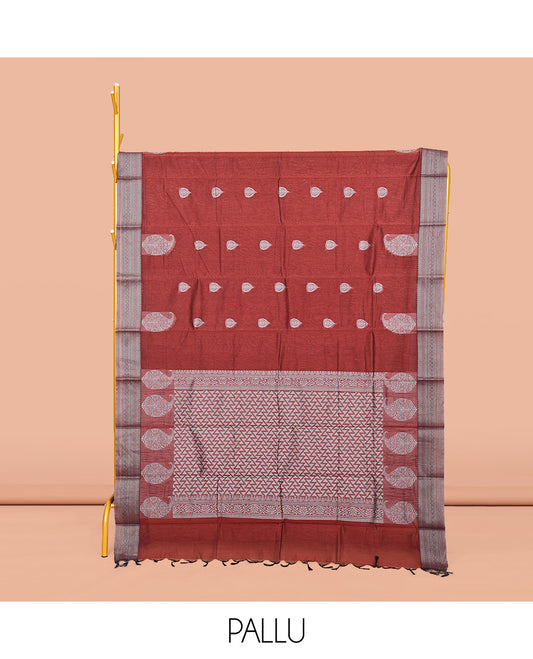 Maroon Semi-Silk Cotton Saree, Delicately Designed with Buttas All Over Its Body, Traditional Design Border of Paisleys, Geometric-Patterned Pallu, and Paired with a Matching Blouse