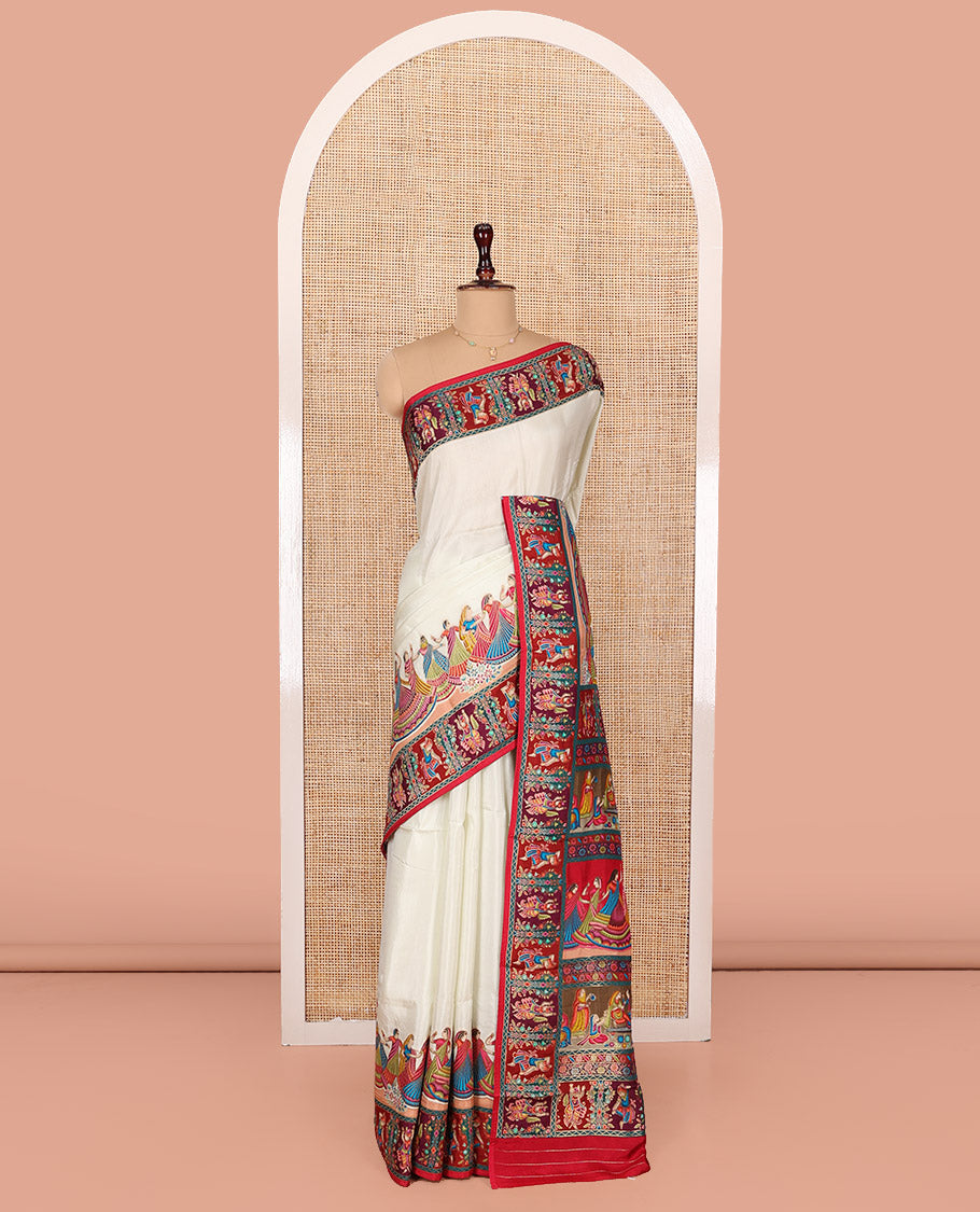 White Dola Silk Saree, Creatively Printed with Human Figurines on Its Body, Complemented by a Contrast Human Figurines Border, Pallu Depicts Colorful Human Figurines, and Paired with a Matching Blouse