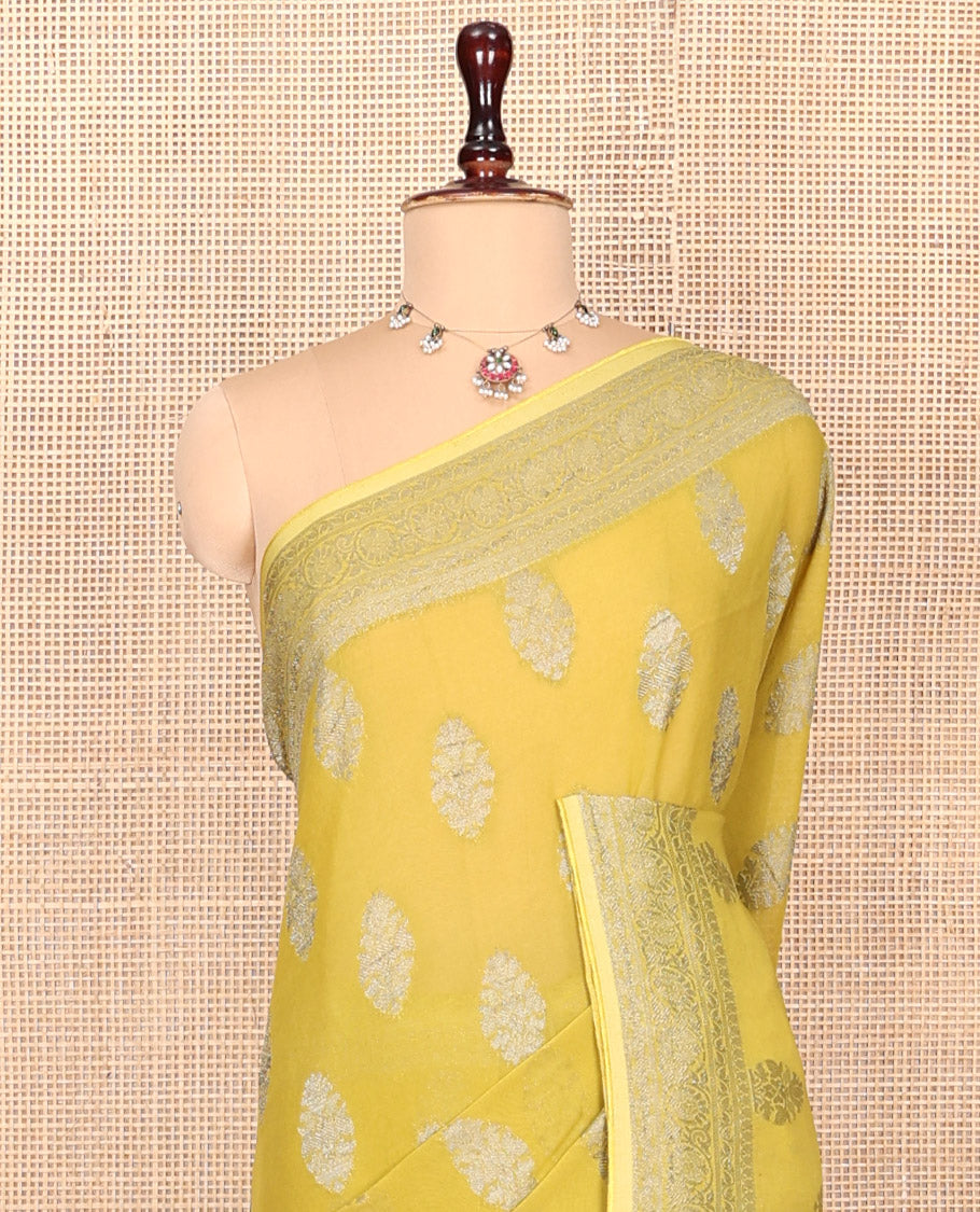 Yellow Georgette Saree, Elevated with Buttas, Highlighted by a Traditional Border, Floral Jaal Pallu, and a Matching Blouse