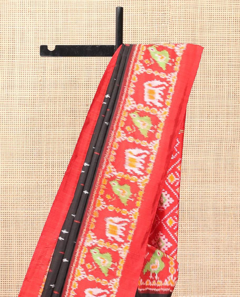 Black Pochampally Ikat Saree, Adorned with Buttas and Horse Rider Ikat Weave, a Contrast Ikat Animal Weave Border, Jaal Pallu, and a Contrast Blouse