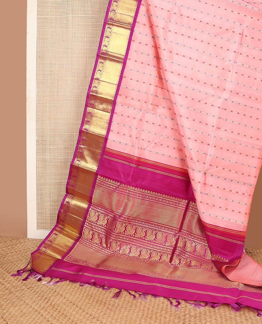 Peach Meena manga buttas kanchipuram silksaree, contrast one-sided korvai border & pallu of salngai,lavangam & mayil designs