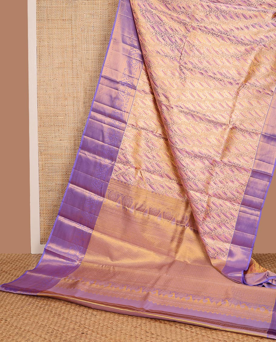 Pink Kanchipuram Tissue Silk Saree, Mesmerized with Jacquard Design on Its Body, Complemented by a Contrast Border of Thilakam, and Dhavana Kodi Designs, Pallu Steeped with Poun Designs, and Paired with a Contrast Blouse