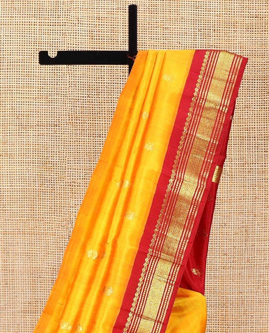 Yellow Kanchipuram Silk Saree, Woven with Zari Buttas All Over Its Body, Complemented by a Contrast One-Sided Korvai Border of Salngai, Banaras, Muthu, and Mayil Kann Designs, Pallu of Zari Designs, and Comes Without a Blouse