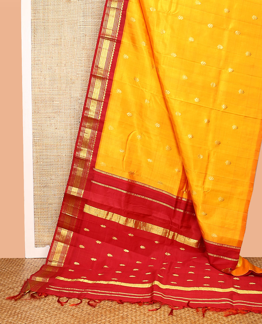 Yellow Kanchipuram Silk Saree, Woven with Zari Buttas All Over Its Body, Complemented by a Contrast One-Sided Korvai Border of Salngai, Banaras, Muthu, and Mayil Kann Designs, Pallu of Zari Designs, and Comes Without a Blouse