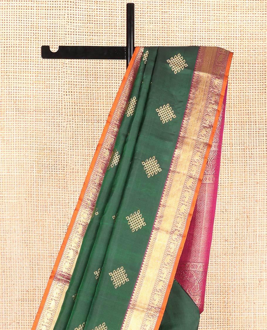 Green Kanchipuram Soft Silk Saree Artfully Detailed with Kolam Buttas, Complemented by a Contrast Border of Thilakam Mokku, Muthu, Yaanai, and Mayil Designs, Zari-Rich Pallu of Mayil Kann Designs, and Paired with a Contrast Blouse