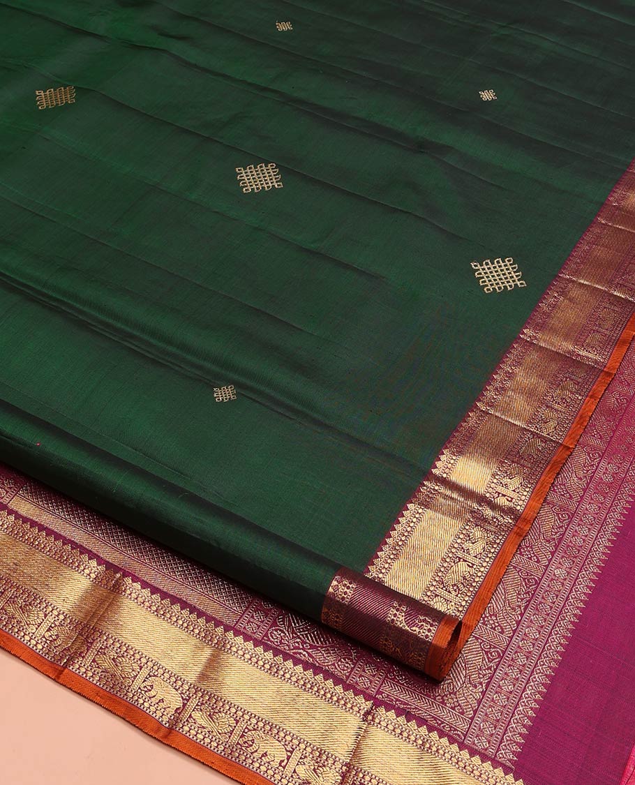 Green Kanchipuram Soft Silk Saree Artfully Detailed with Kolam Buttas, Complemented by a Contrast Border of Thilakam Mokku, Muthu, Yaanai, and Mayil Designs, Zari-Rich Pallu of Mayil Kann Designs, and Paired with a Contrast Blouse