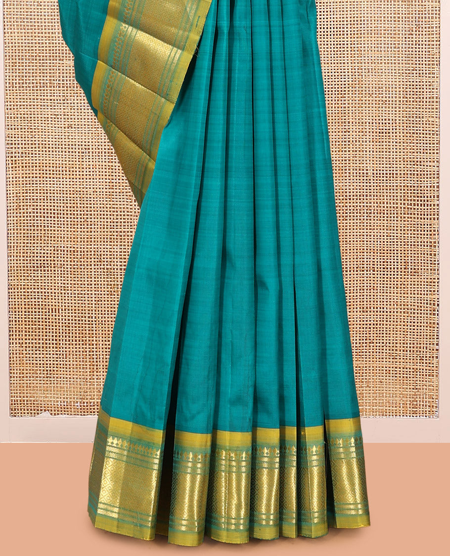 Green Kanchipuram Silk Saree, Adorned with Zari Buttas, Complemented by a Contrast Border of Panner Sombu, Banaras, and Mayil Kann Design, Pallu of Zari Design, and No Blouse